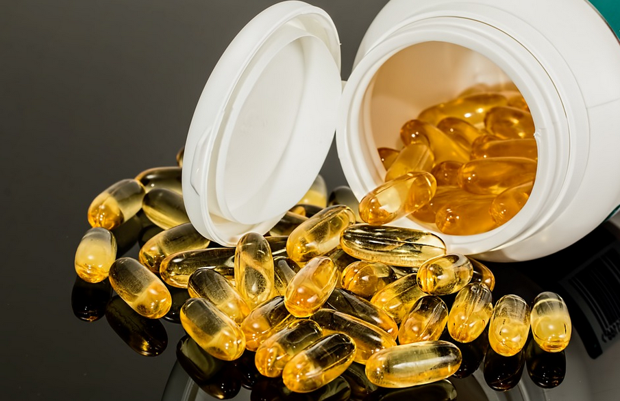 supplements spilling from a bottle